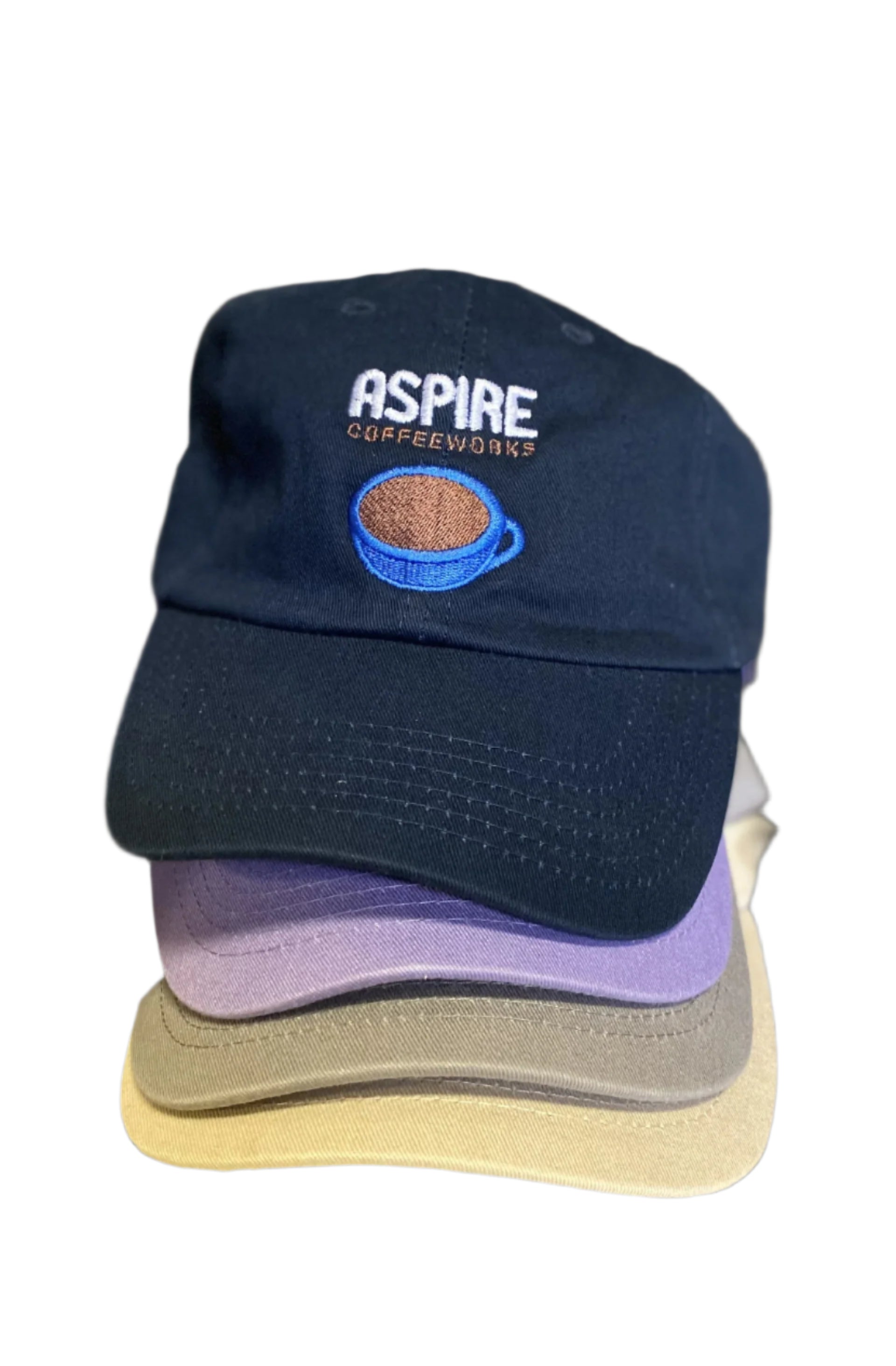 Navy blue cap with 'Aspire Coffeeworks' logo on a metallic surface